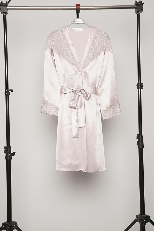 Satin women nighty on a white background. photo