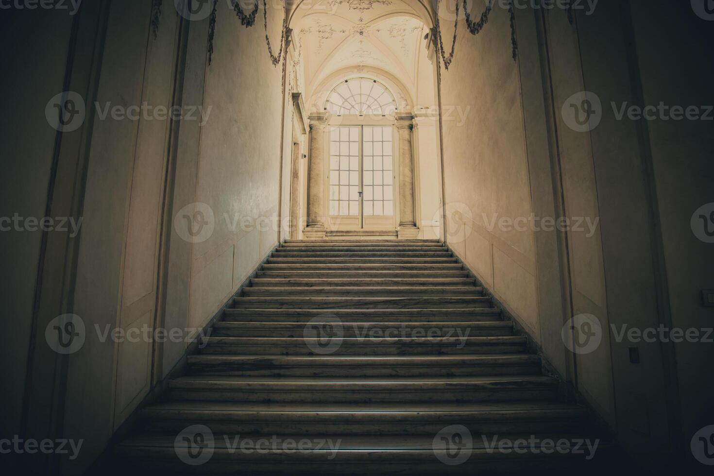 Ancient dark staircase - Grunge interior, nobody, empty building architecture, window. photo