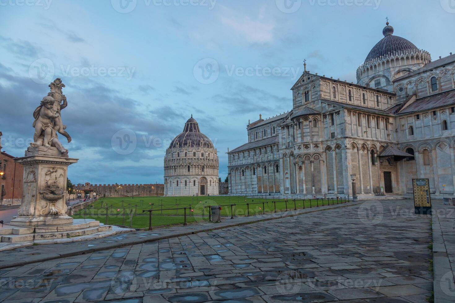 Pisa, Italy. Cathedral exterior with baptistery, early morning light photo