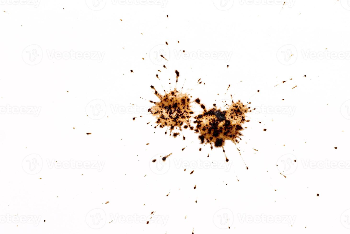 Coffee drops splashes with a brown color texture isolated on a white background photo
