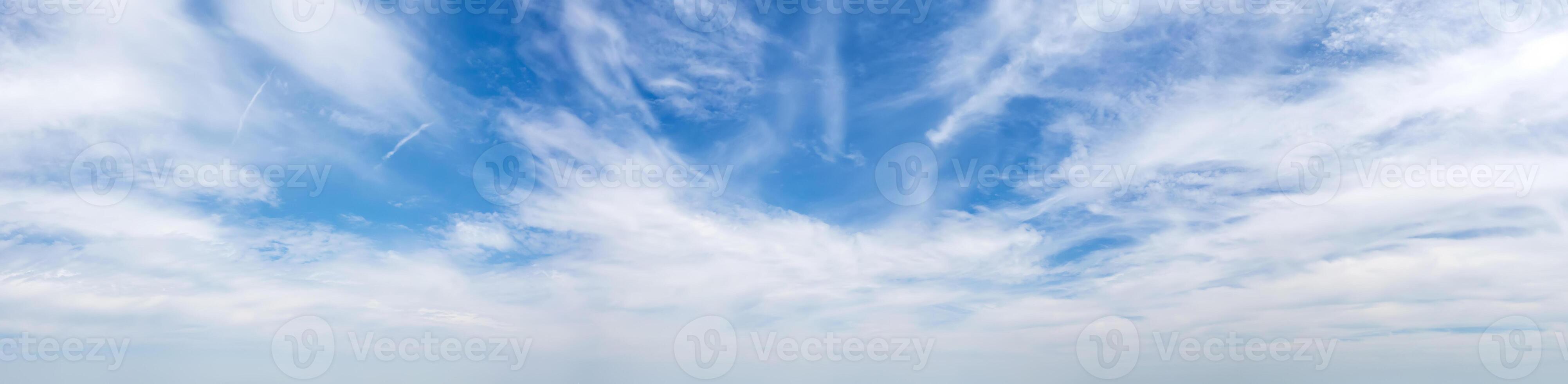 Panoramic view of blue sky with fluffy clouds photo