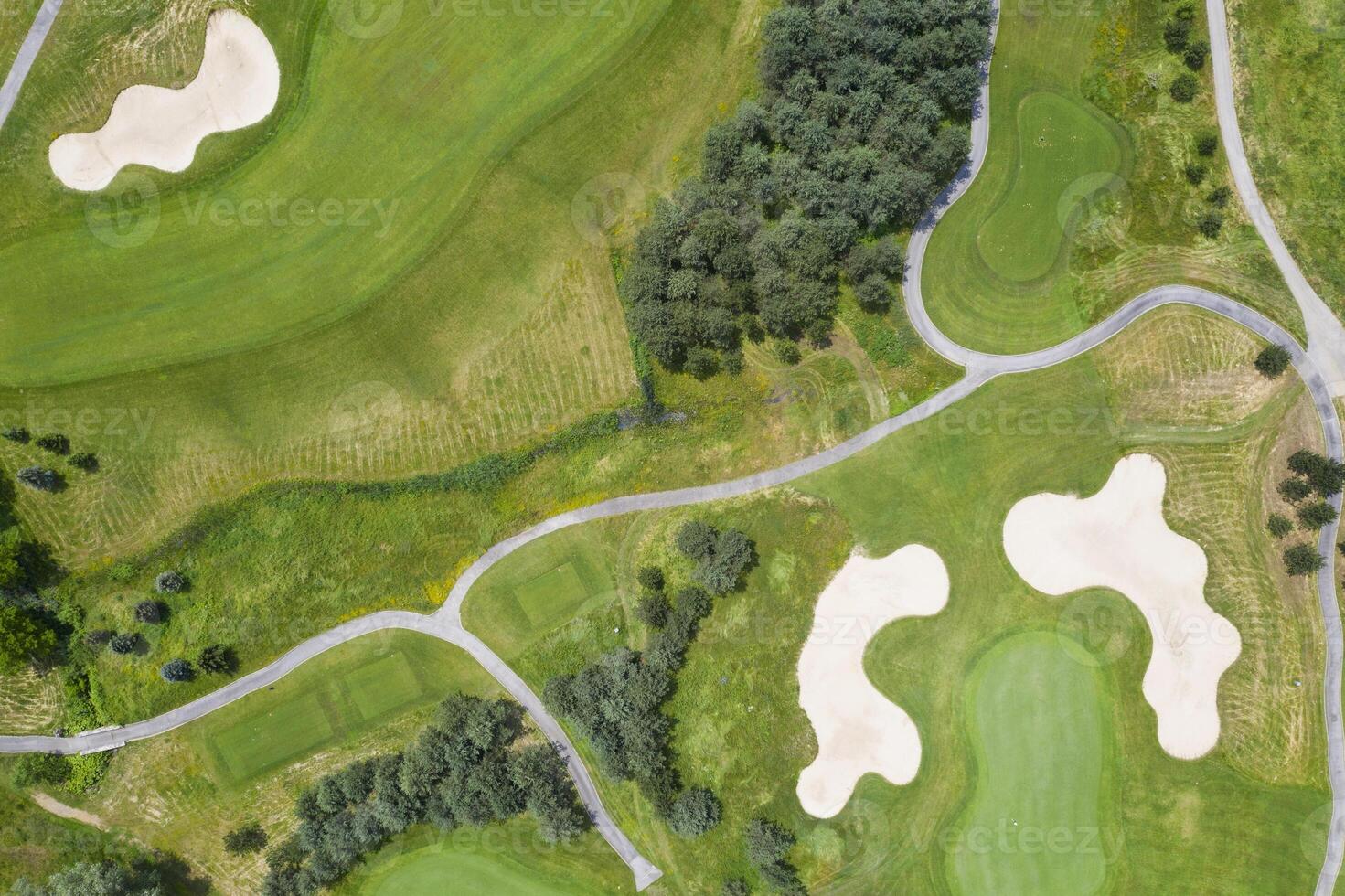 Landscape in a golf course an aerial view of a green field, lawn, and grass. photo