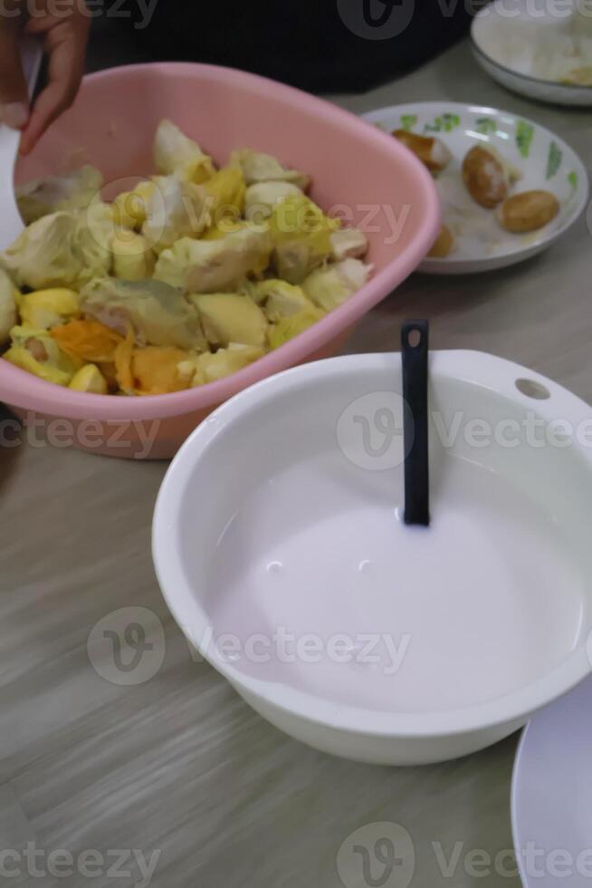 Appetizing durian dessert with sticky rice mixed in coconut milk. photo