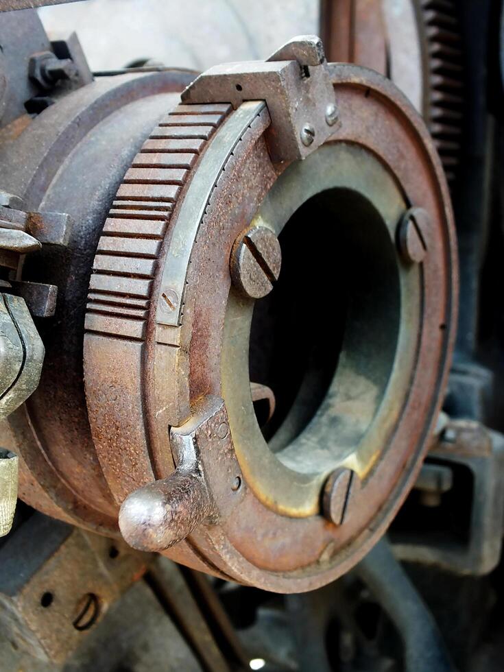 Close up of a part of the internal structure of an engine. Grunge steampunk industrial machine concept design image background photo