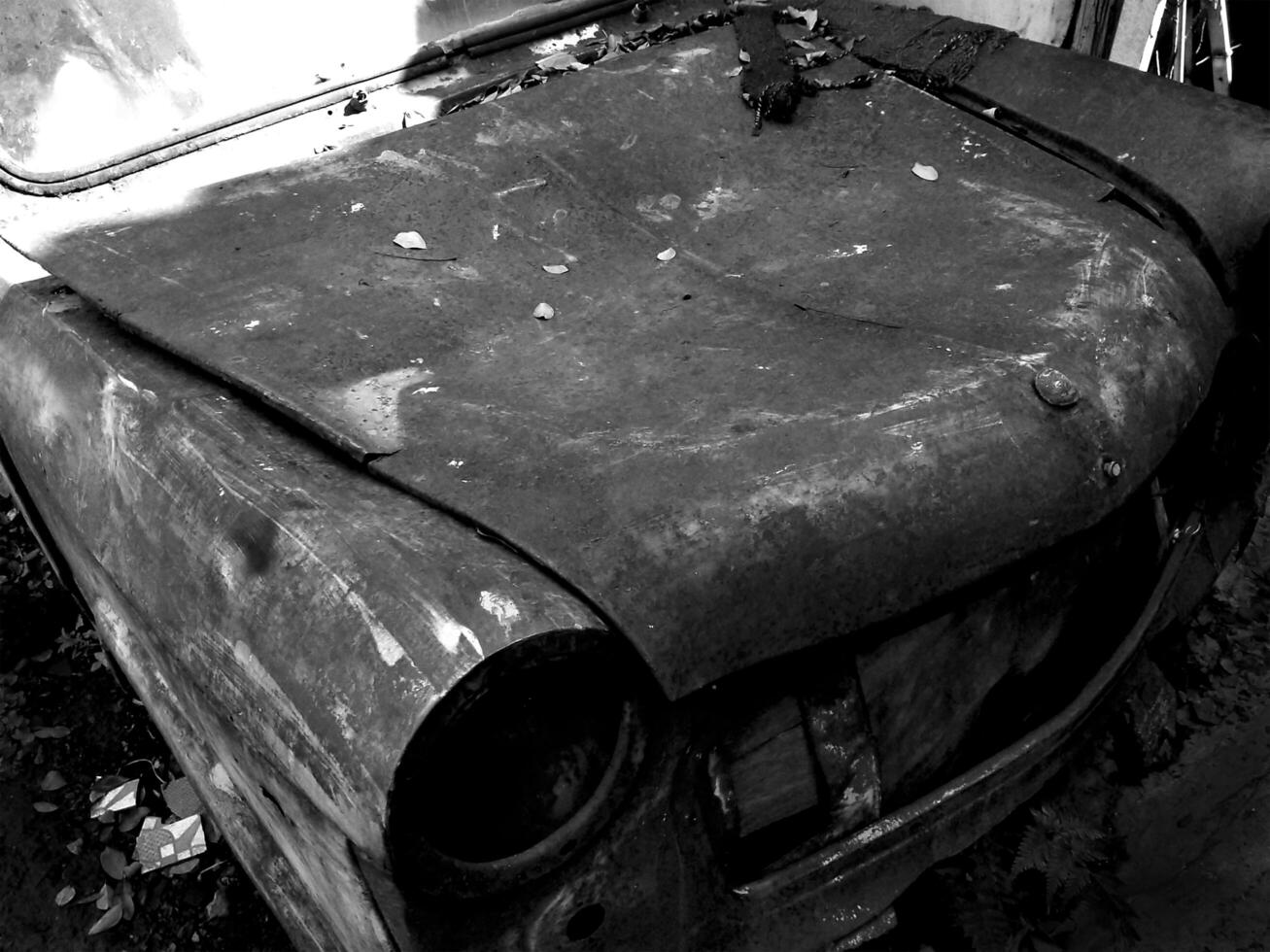 Old abandoned and rusty vintage retro car. The car is in very bad condition. Story from the past automotive concept background. photo