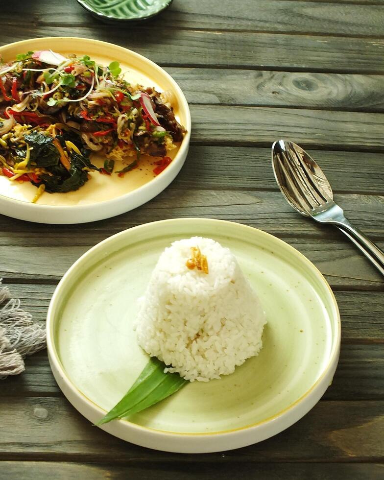 Assorted asian food set. Rice with side dishes on the wooden table. Top view. enjoy meal Time moment restaurant concept. Asian style banquet photo