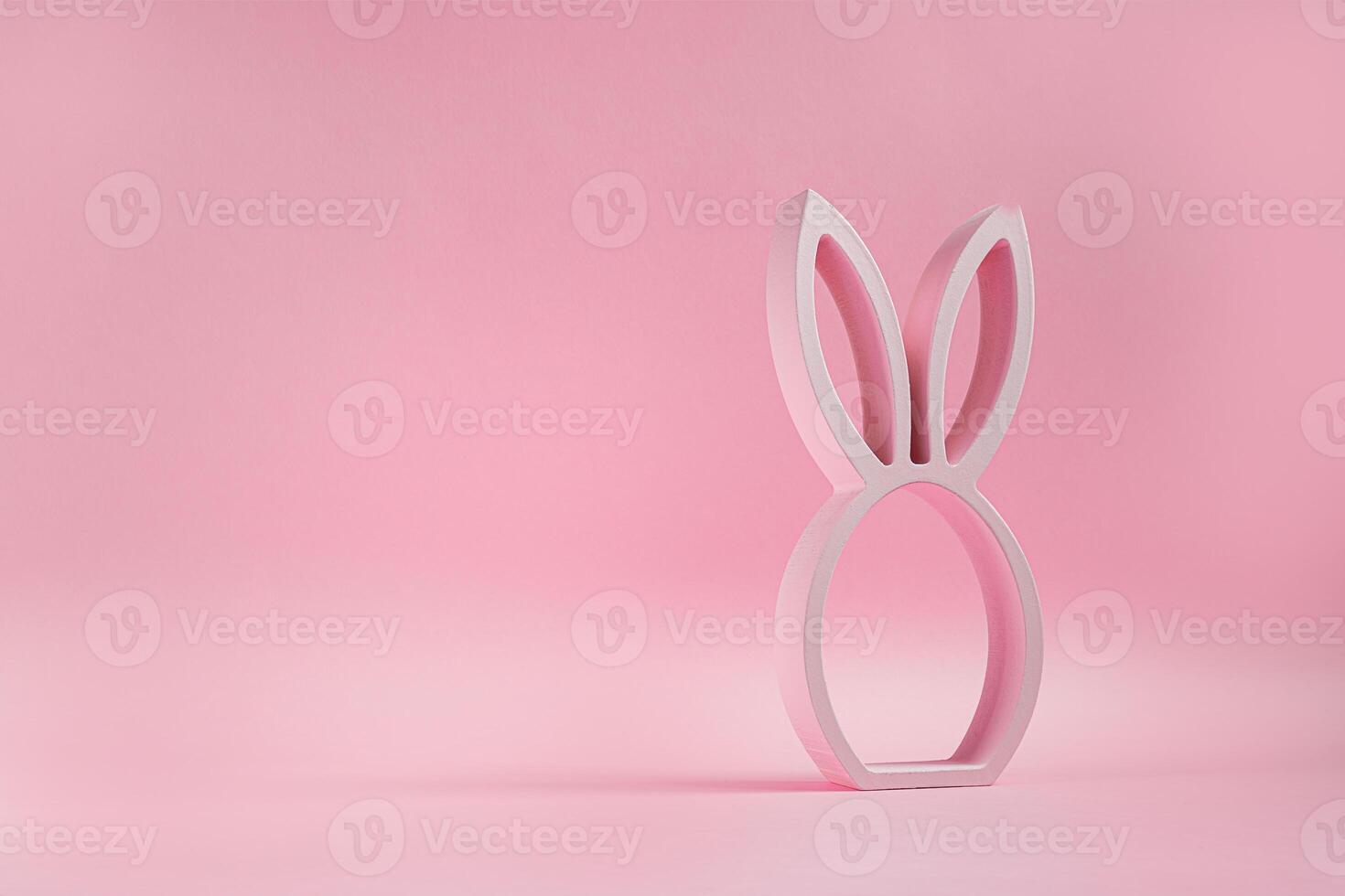 Easter bunny figurine on pink photo