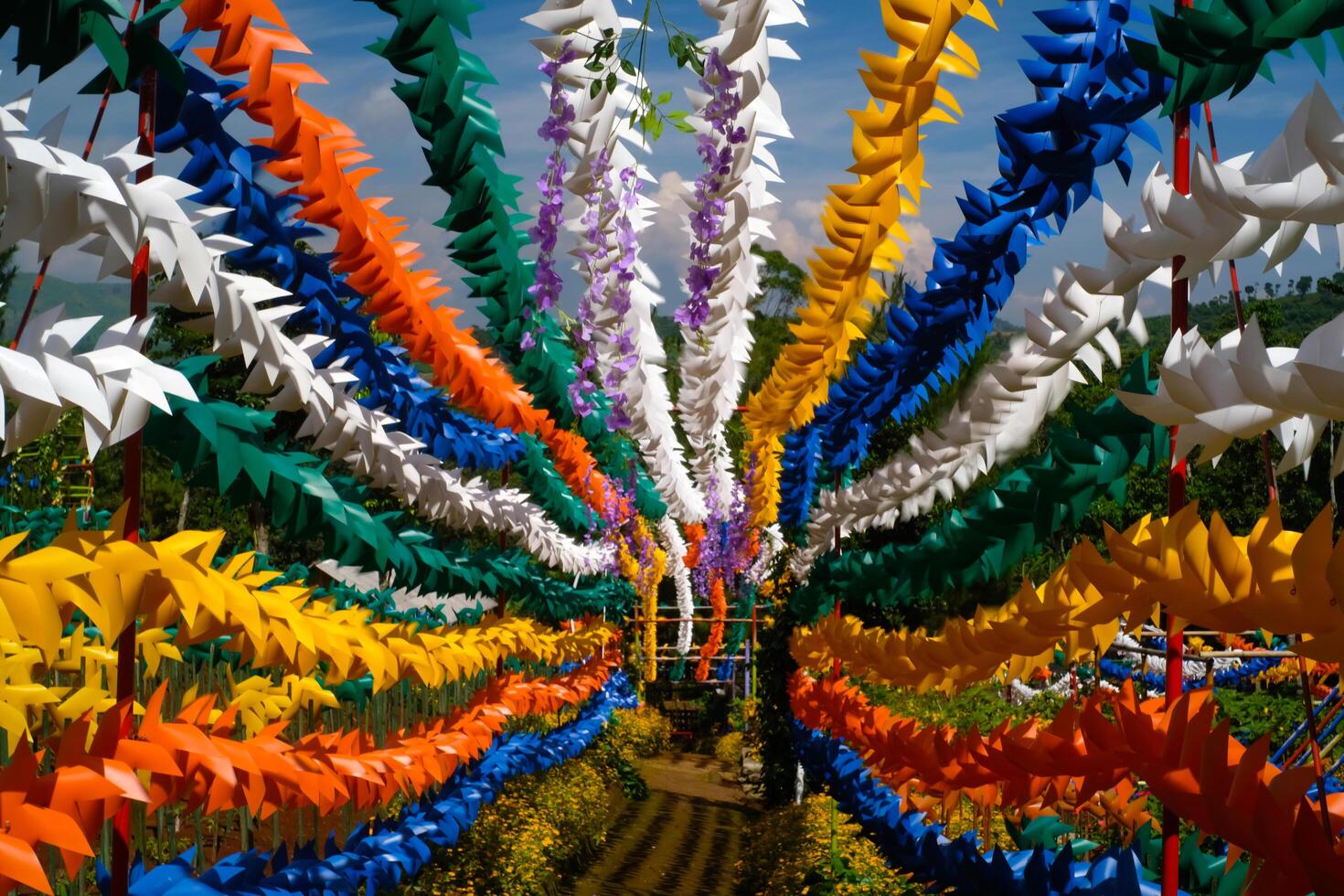 Geometric photo of Colorful Hallway full of Pinwheels. Background of natural scenery in amusement park. Graphic Resources. Background Photography. Travel Destinations