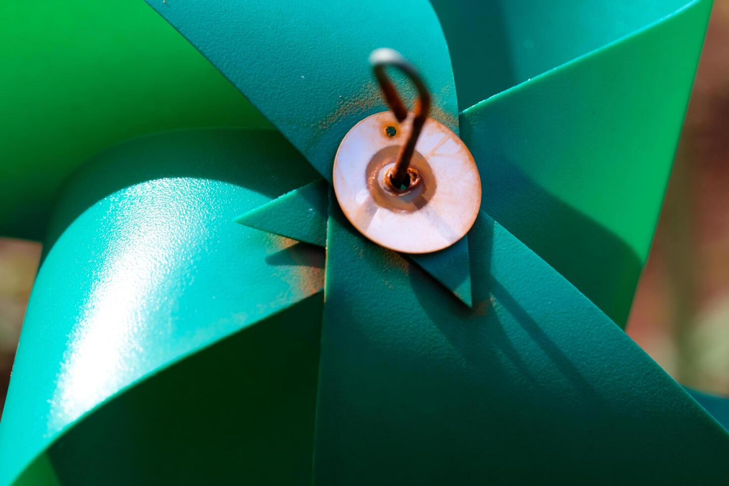 Close-up of plastic green Pinwheel in amusement park. Abstract Background of ornament in amusement park. Graphic Resources. Macro Photography. Travel Destinations. Holiday photography concept photo