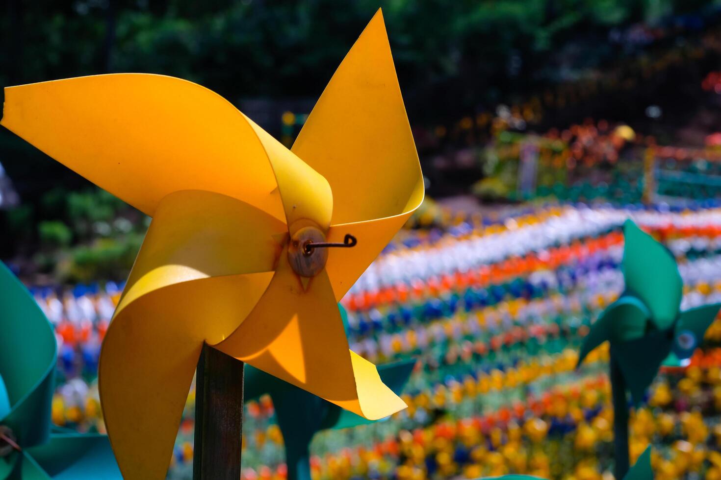 Close-up of plastic Yellow Pinwheel in amusement park. Abstract Background of ornament in amusement park. Graphic Resources. Macro Photography. Travel Destinations. Holiday photography concept photo