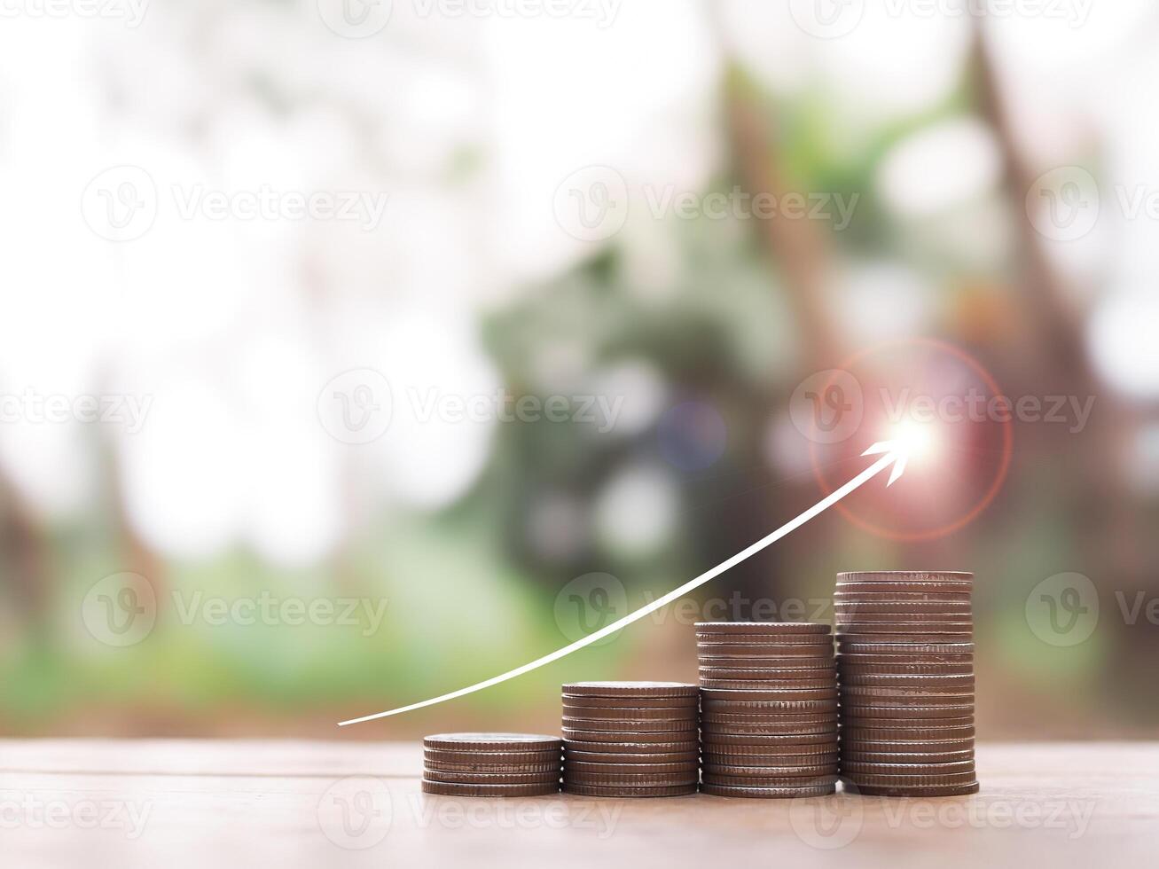 Stack of coins with arrow rising up. The concept of saving money, Financial, Investment and Business growing up. photo