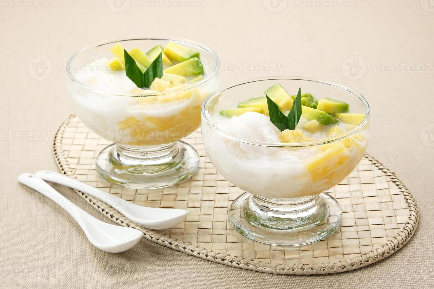 Es teler or es teller, Indonesian dessert, consist of avocado, young coconut, jackfruit, served with coconut milk or sweetened condensed milk. photo