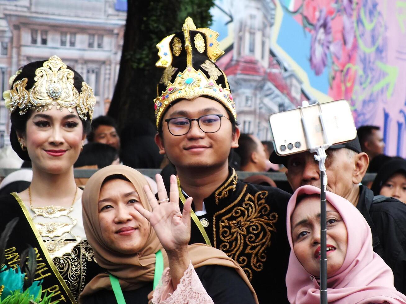 Bandung City, West Java, Indonesia, Southeast Asia, July 6 2024. Parade of traditional costumes and arts along the streets of Asia Africa. photo