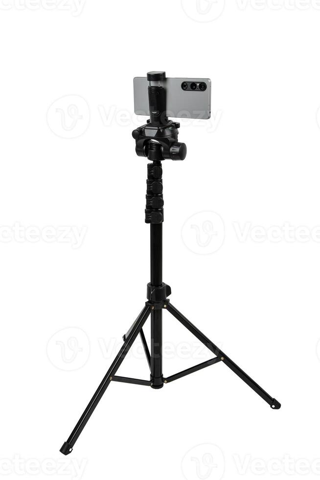 Smartphone mounted on a tripod. Stable photo or shooting for a blog or social media content. Isolate on a white back.