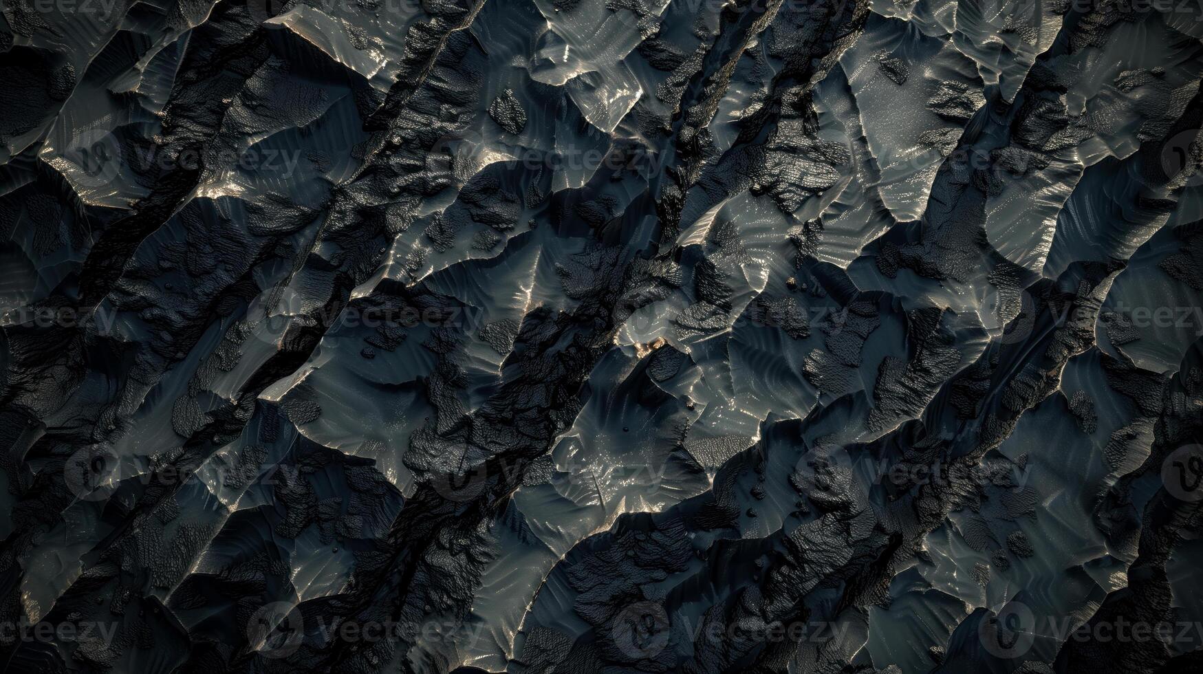 Rough dark stone texture with cracks and gold flecks. Dark back photo