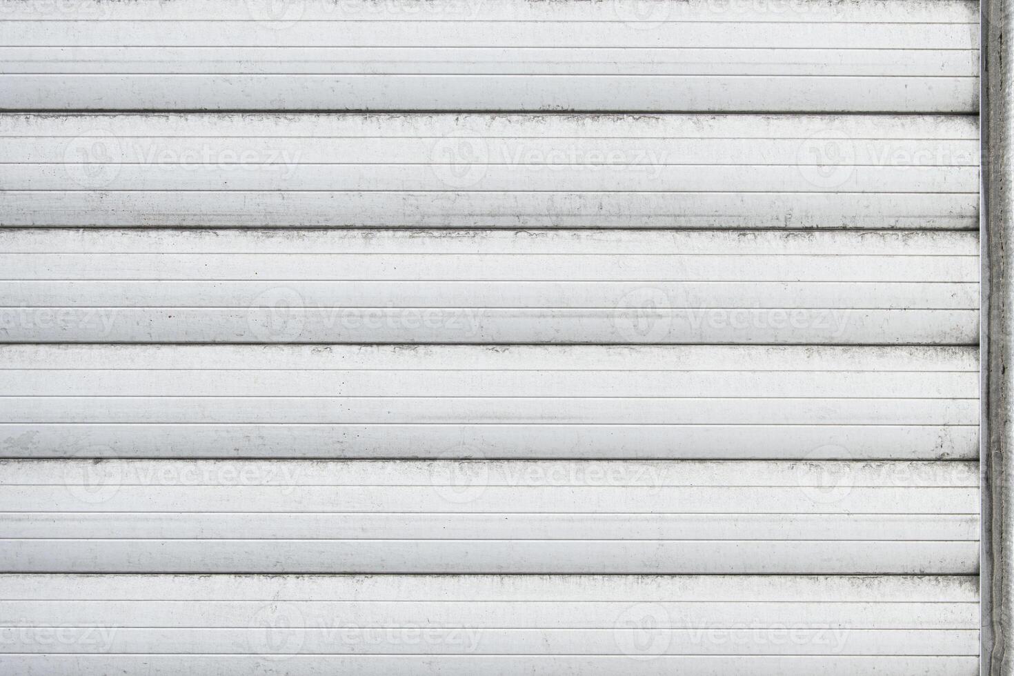 Closed plastic blinds for windows, close-up. external side. White color. traces of time photo