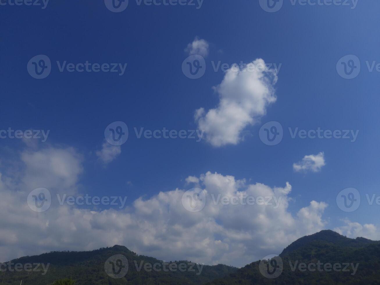 beautiful clouds over the mountain photo