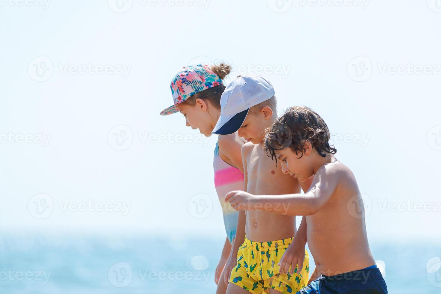 Three Happy Friends on the Beach photo