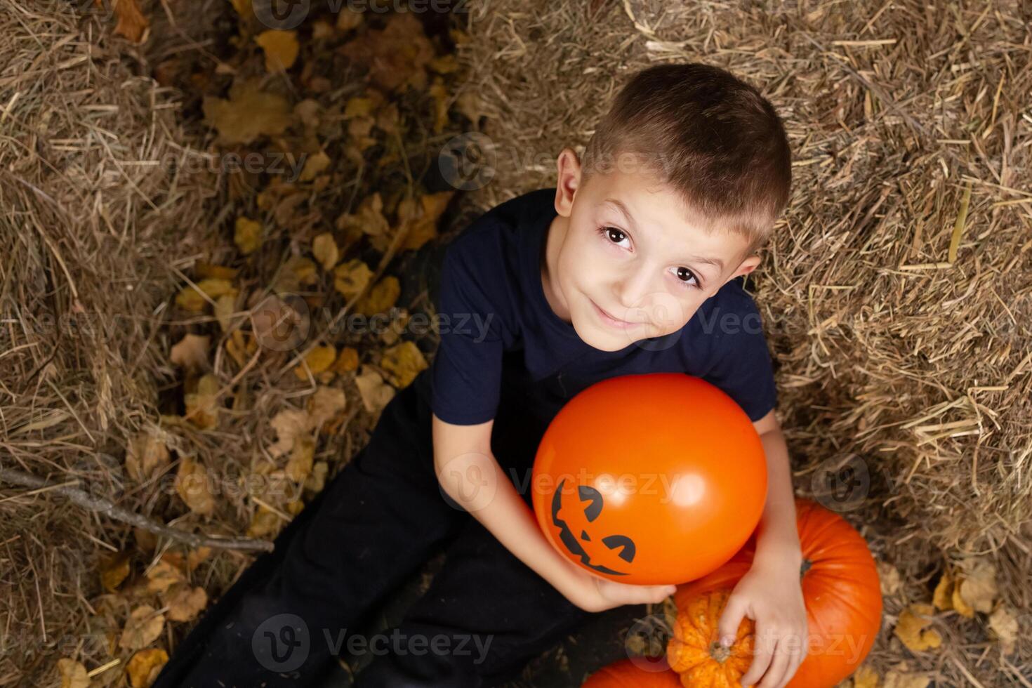 portreit happy children preparing for Halloween. child with halloween pumpkin photo