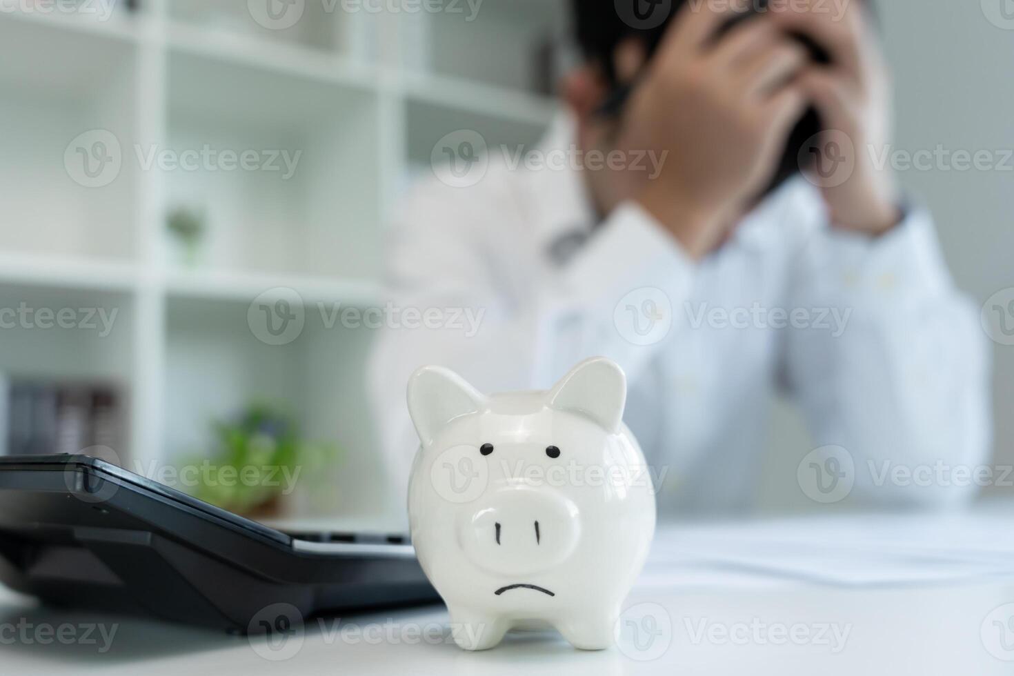 Stressed and headache man with large bills or invoices no money to pay to expenses and credit card debt. shortage, Financial problem, bankruptcy, mortgage, loan, bankrupt, poor, empty wallet photo