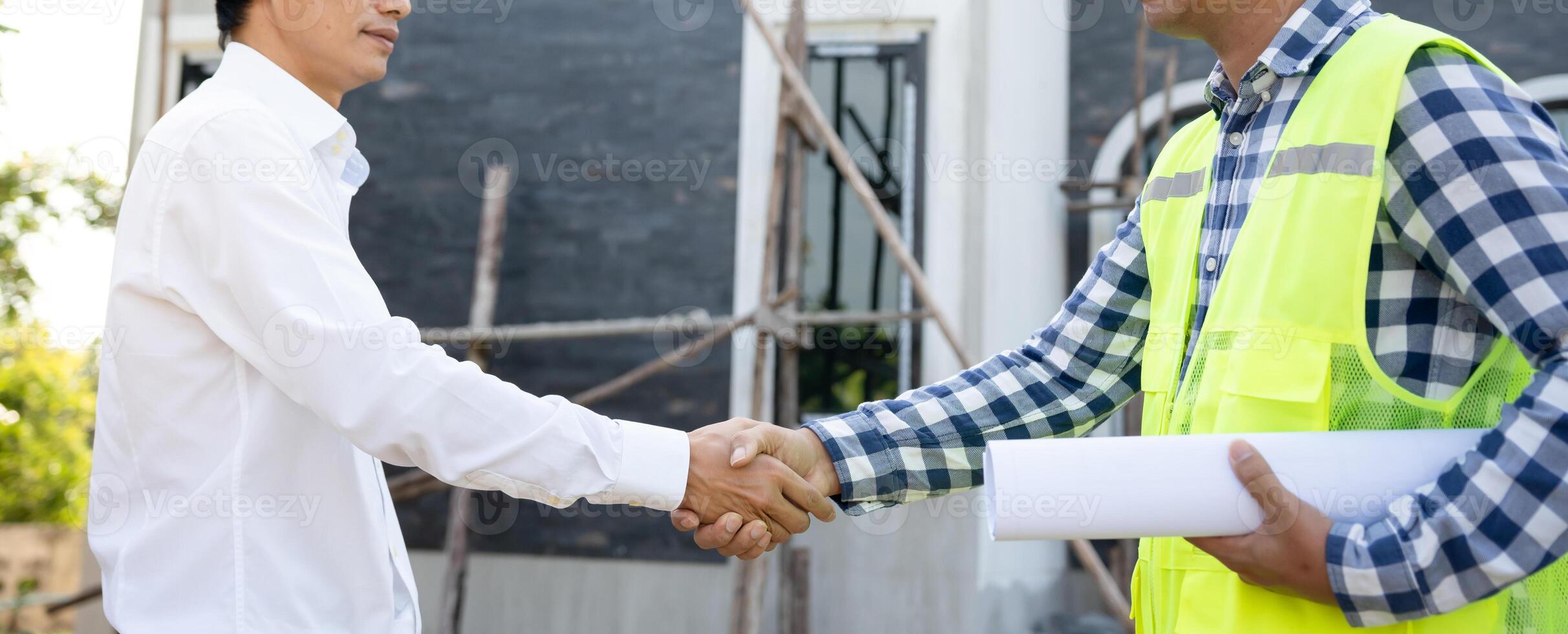 Construction team hands shaking greeting start up plan new project contract in office center at construction site, industry ,architecture, partner, teamwork, agreement, property, contacts. photo