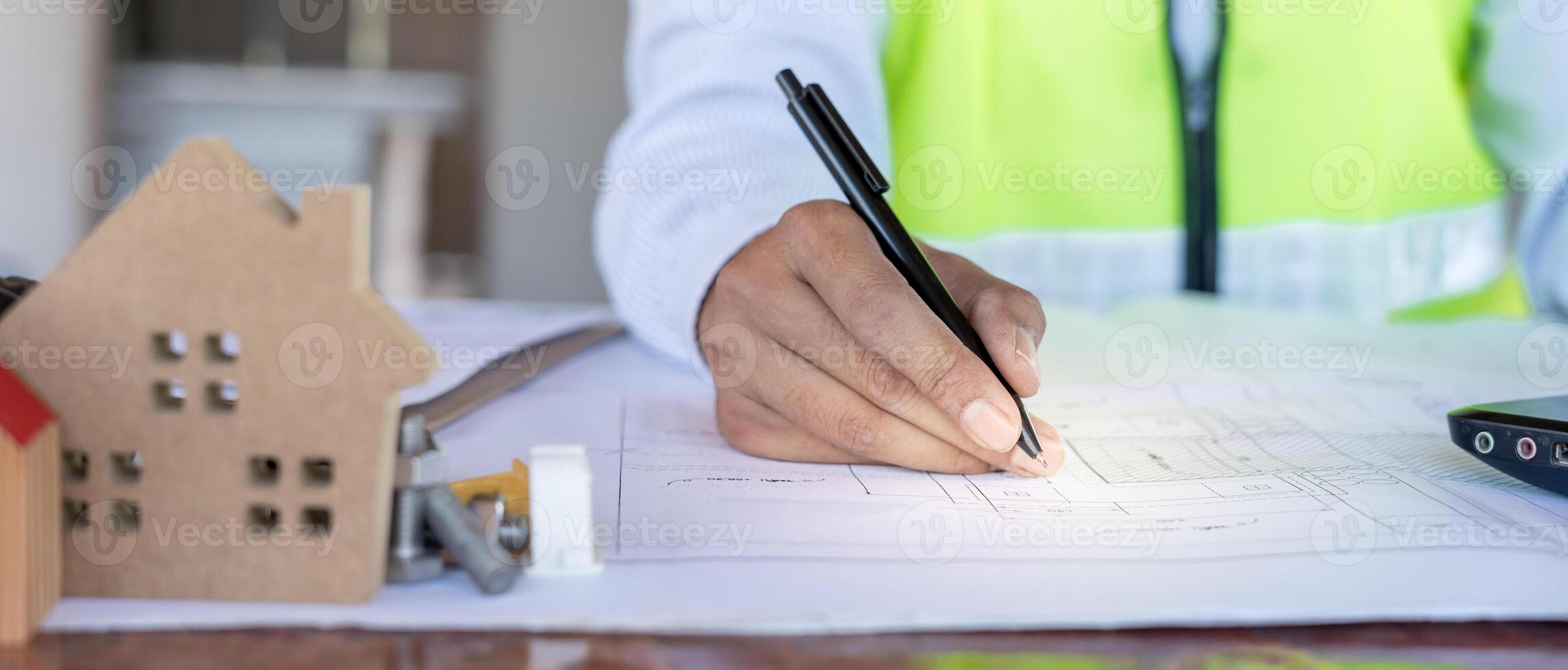 Engineers man recheck and review the blueprint of construction. Contractor inspection drawing before start project civil. Prepare construction project planning, consulting, architecture. photo