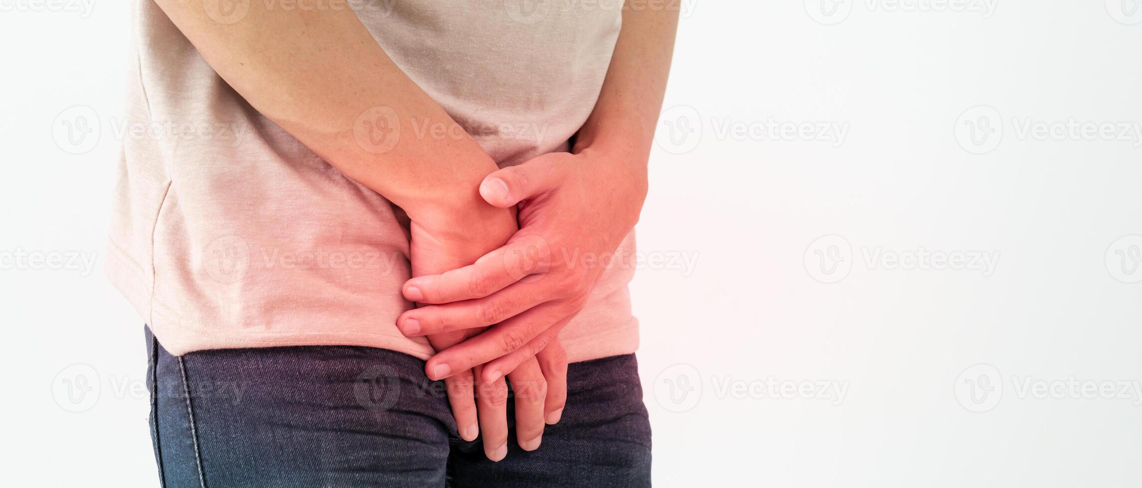Man hold hand in front of private parts feeling discomfort from disease and inflammation. Venereal, testicular cancer. bladder problems, erectile dysfunction, premature ejaculation, prostate cancer photo