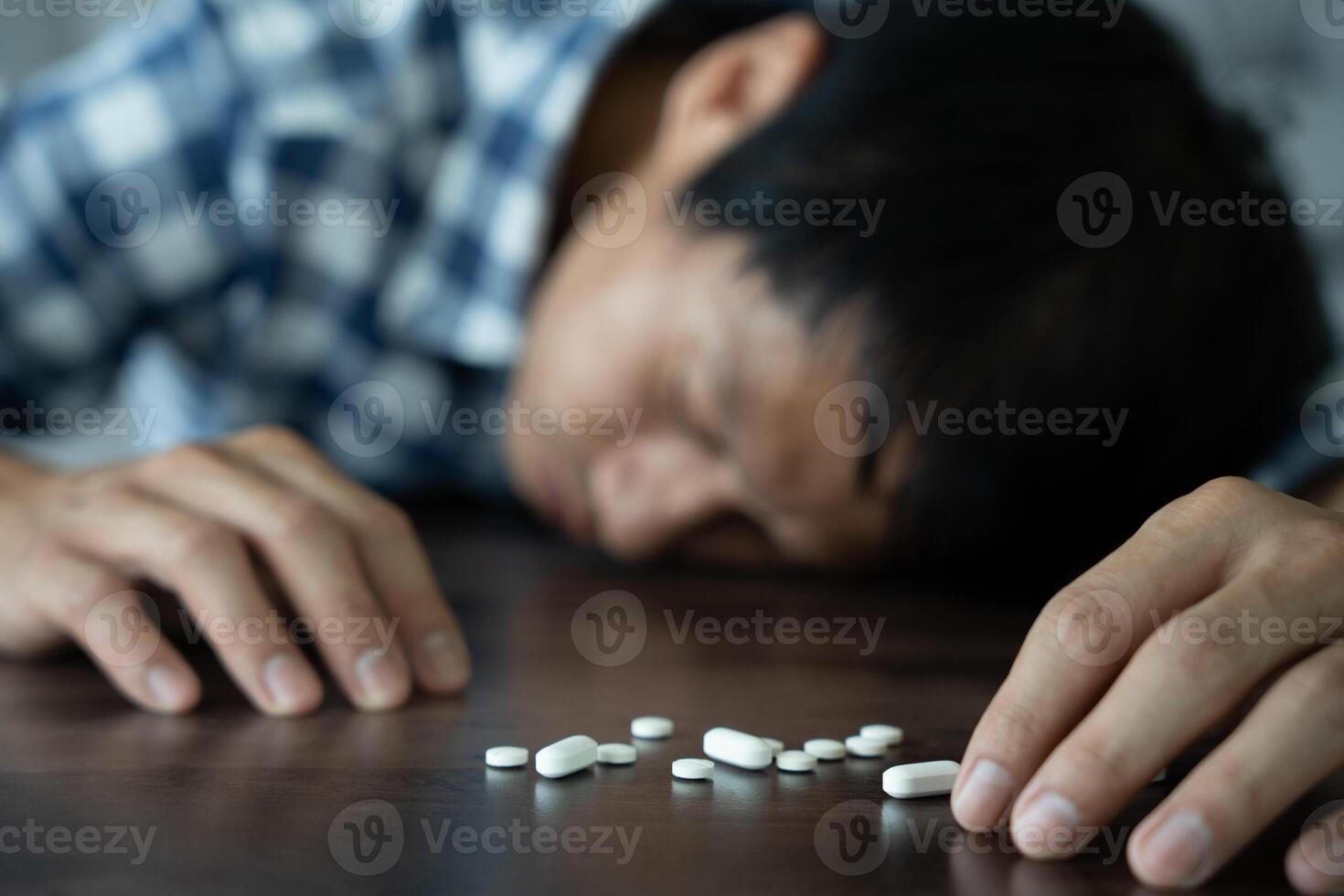asian man use pills overdose, stressed, sad, drug abuser, drug addict, sick, unhealthy, unhappy, suicide, depressed or hopeless, Anti drug, drug addict, life and family problems, unmotivated photo