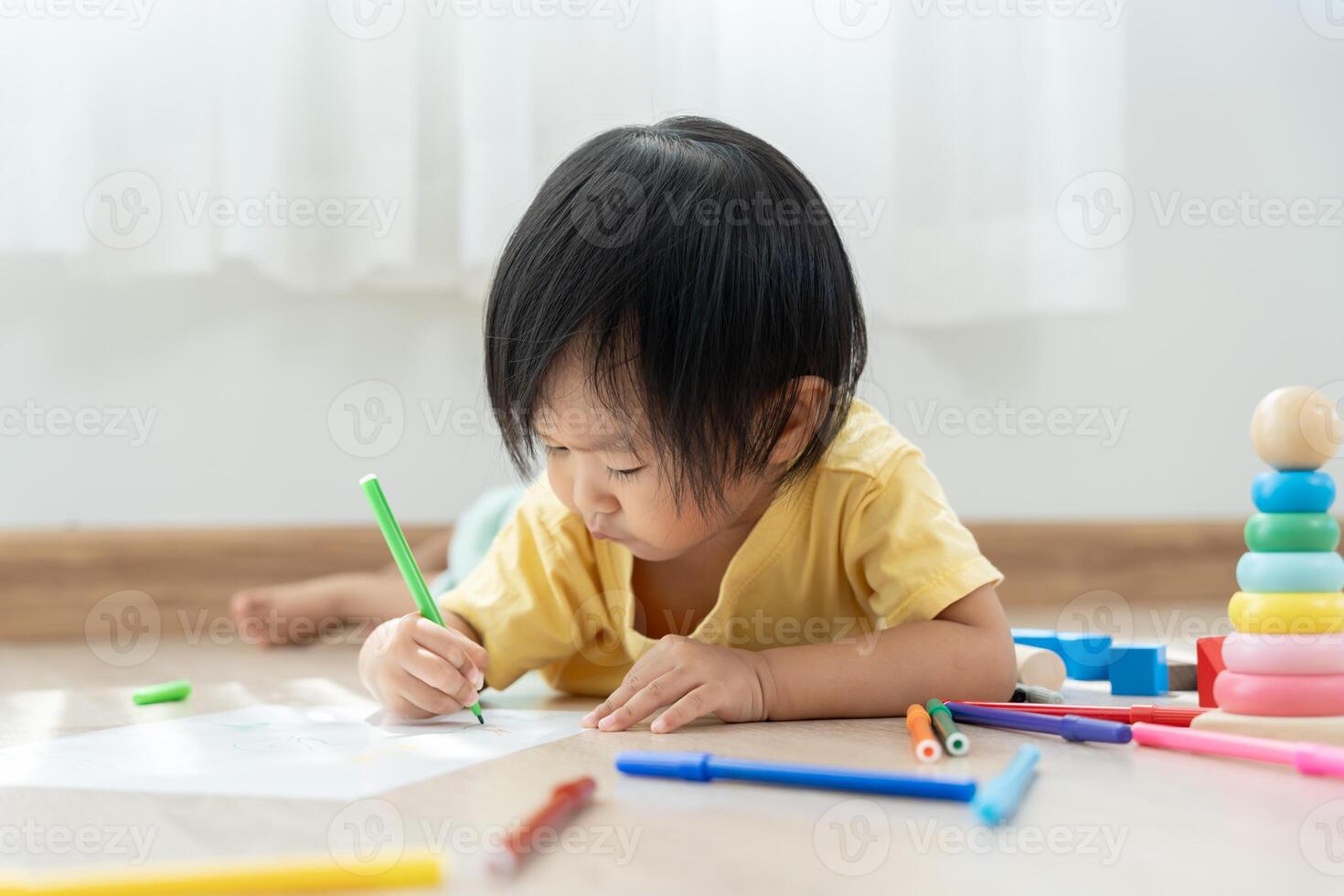 Happy Asia children playing learning paint on paper. Activity, development, IQ, EQ, meditation, brain, muscles, essential skills, family having fun spending time together. Holiday photo