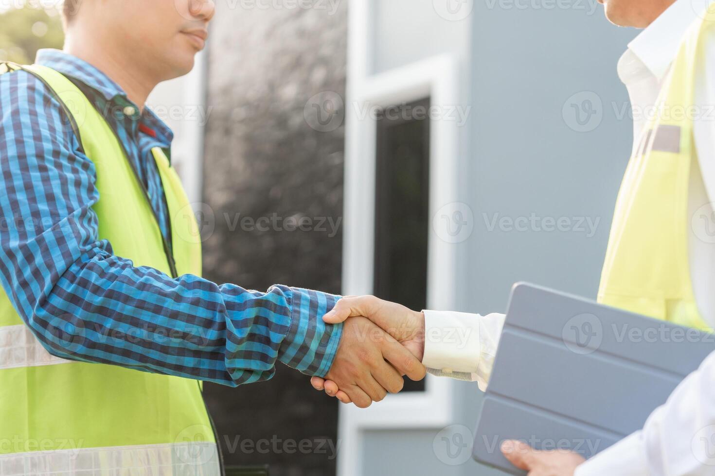 Construction team hands shaking greeting start up plan new project contract in office center at construction site, industry ,architecture, partner, teamwork, agreement, property, contacts. photo
