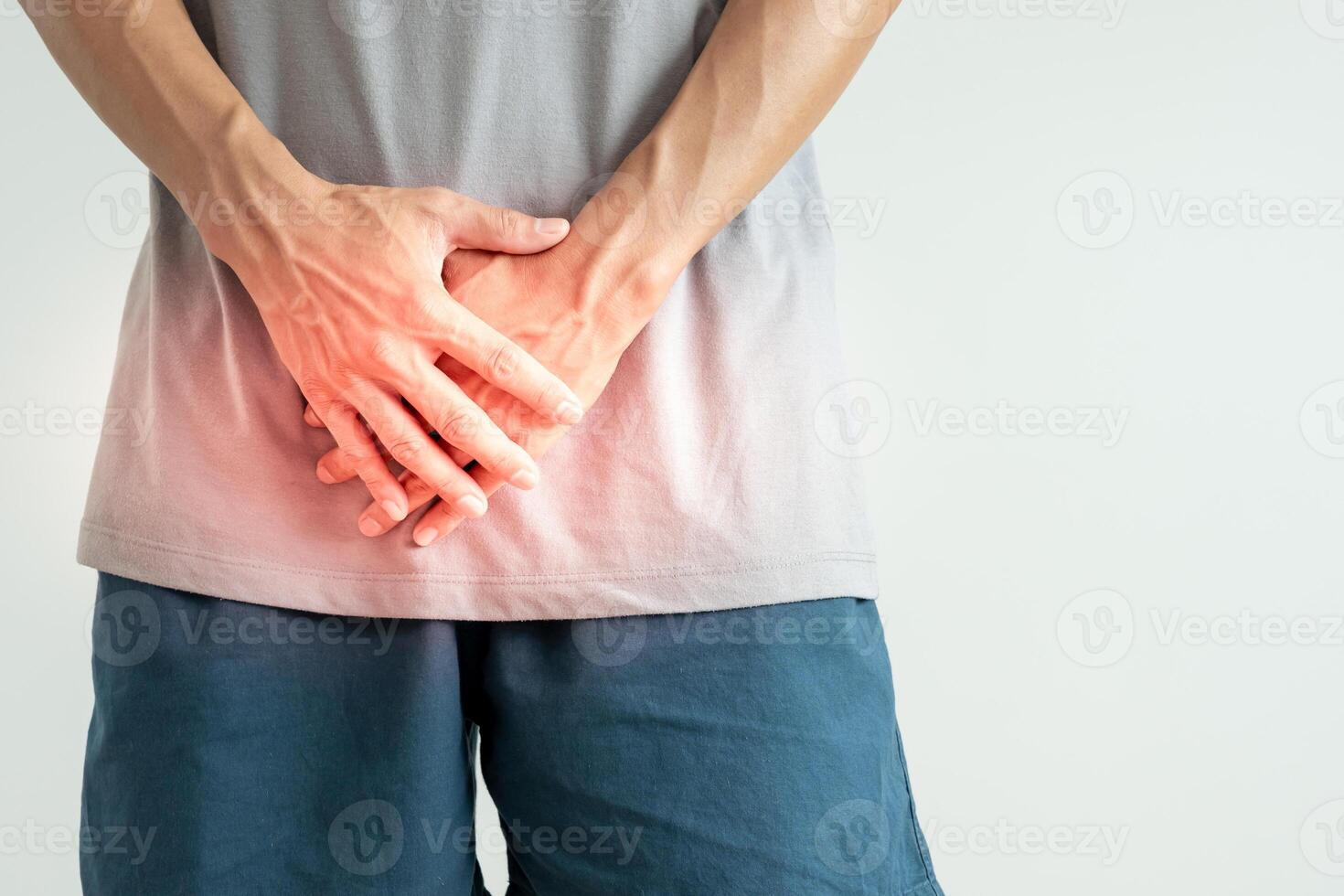 Man hold hand in front of private parts feeling discomfort from disease and inflammation. Venereal, testicular cancer. bladder problems, erectile dysfunction, premature ejaculation, prostate cancer photo