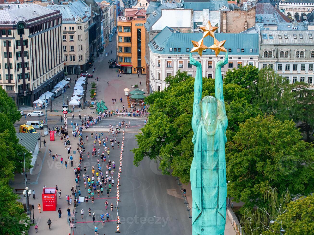 Aerial View of Riga Marathon with Freedom Monument in Foreground photo