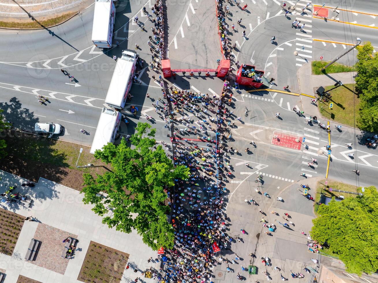 Aerial View of Marathon Runners in Riga, Latvia Surrounded by Spectators photo