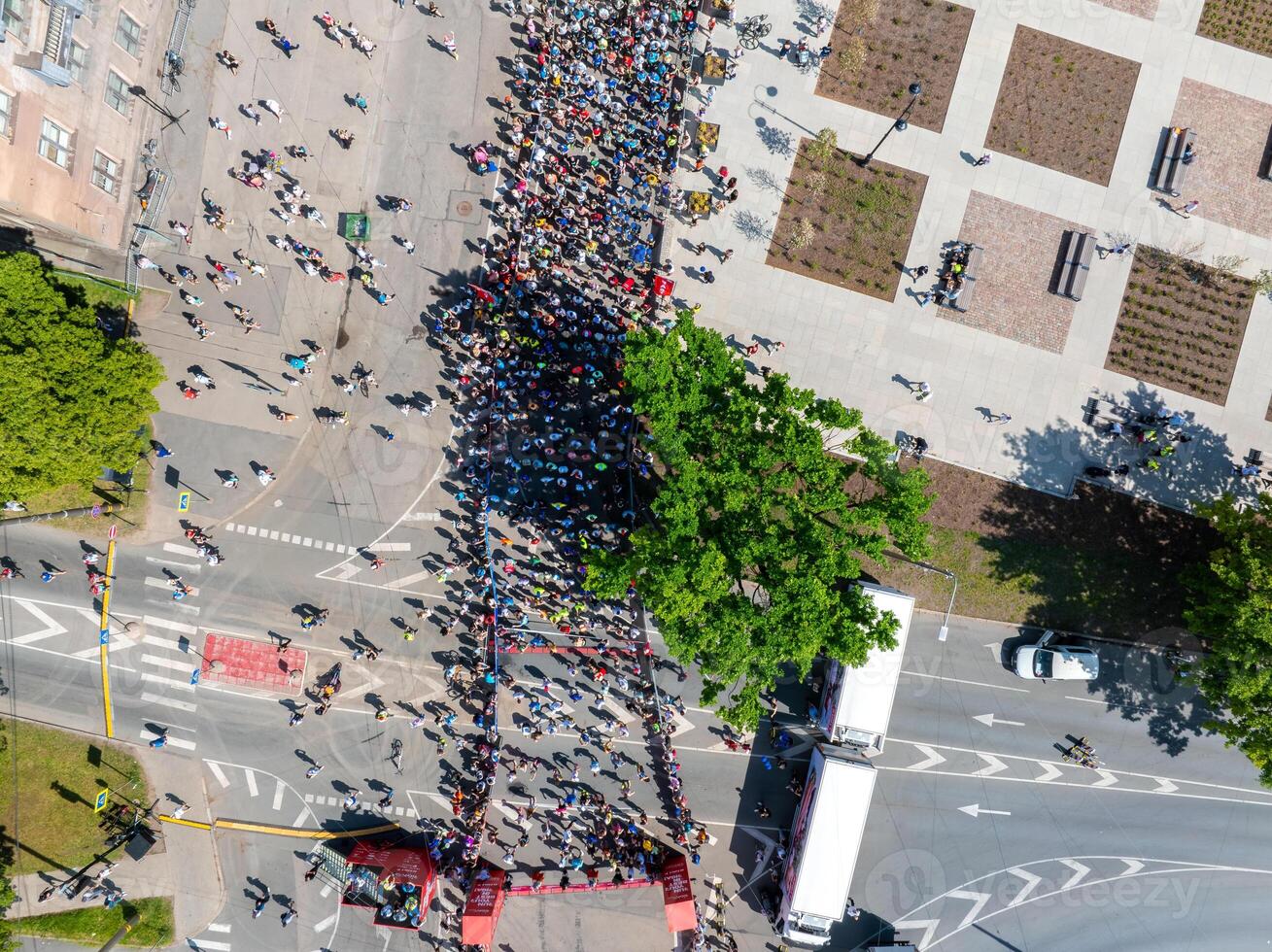 Aerial View of Runners in Riga Rimi Marathon 2024 with City Skyline photo