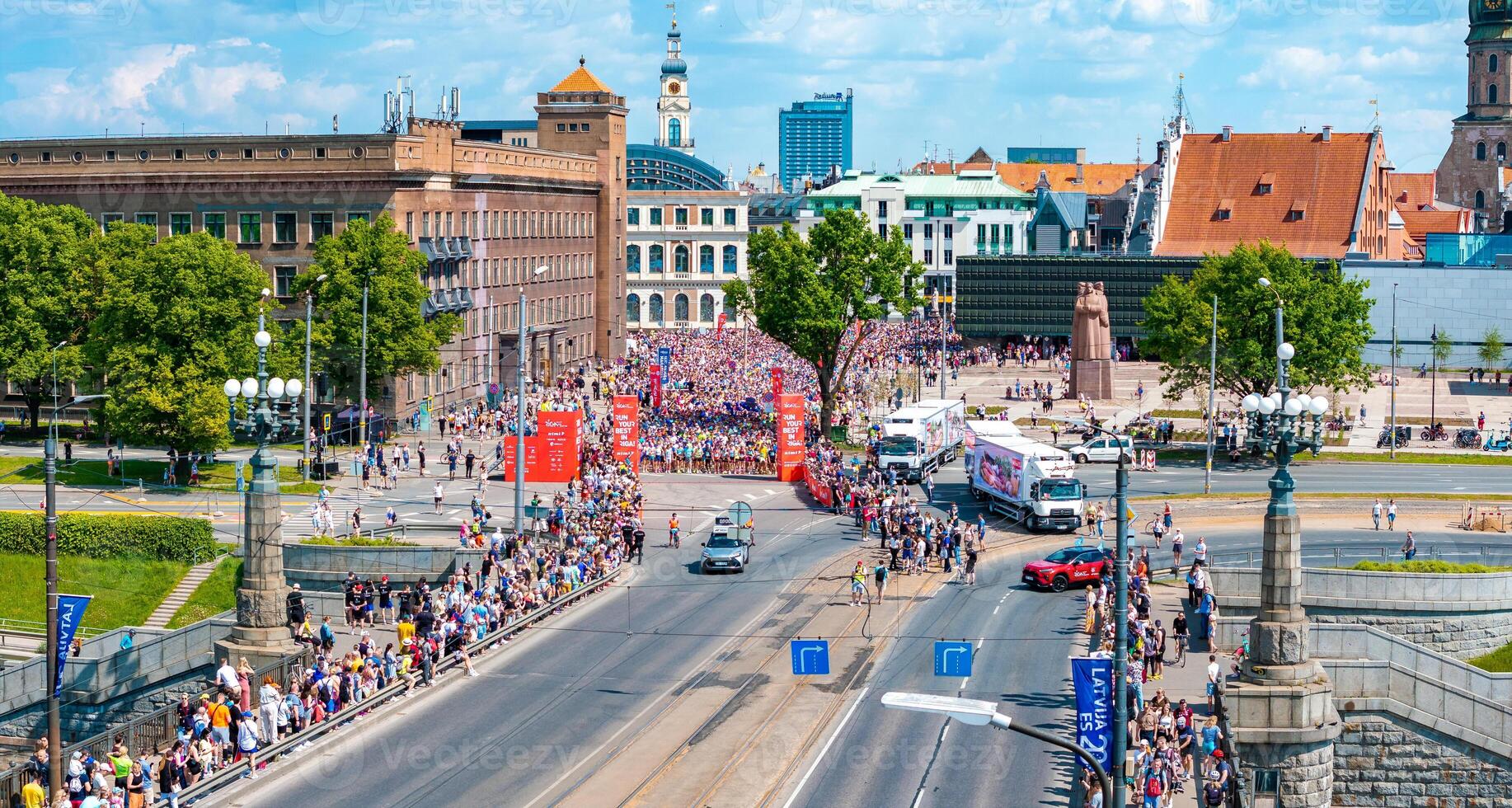 Aerial View of Runners in Riga Rimi Marathon 2024 with Old Town Backdrop photo