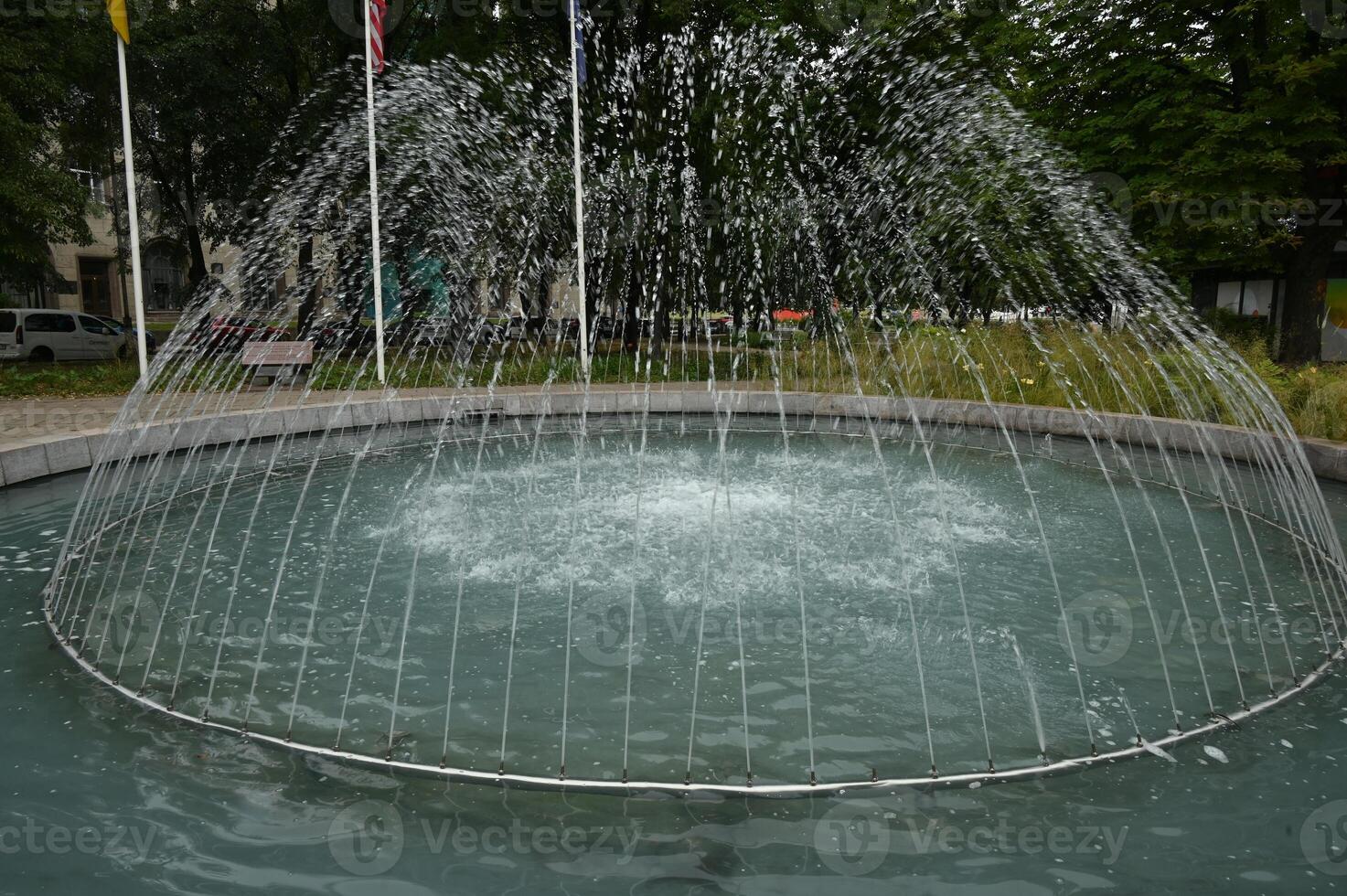 a fountain with water shooting out of it photo