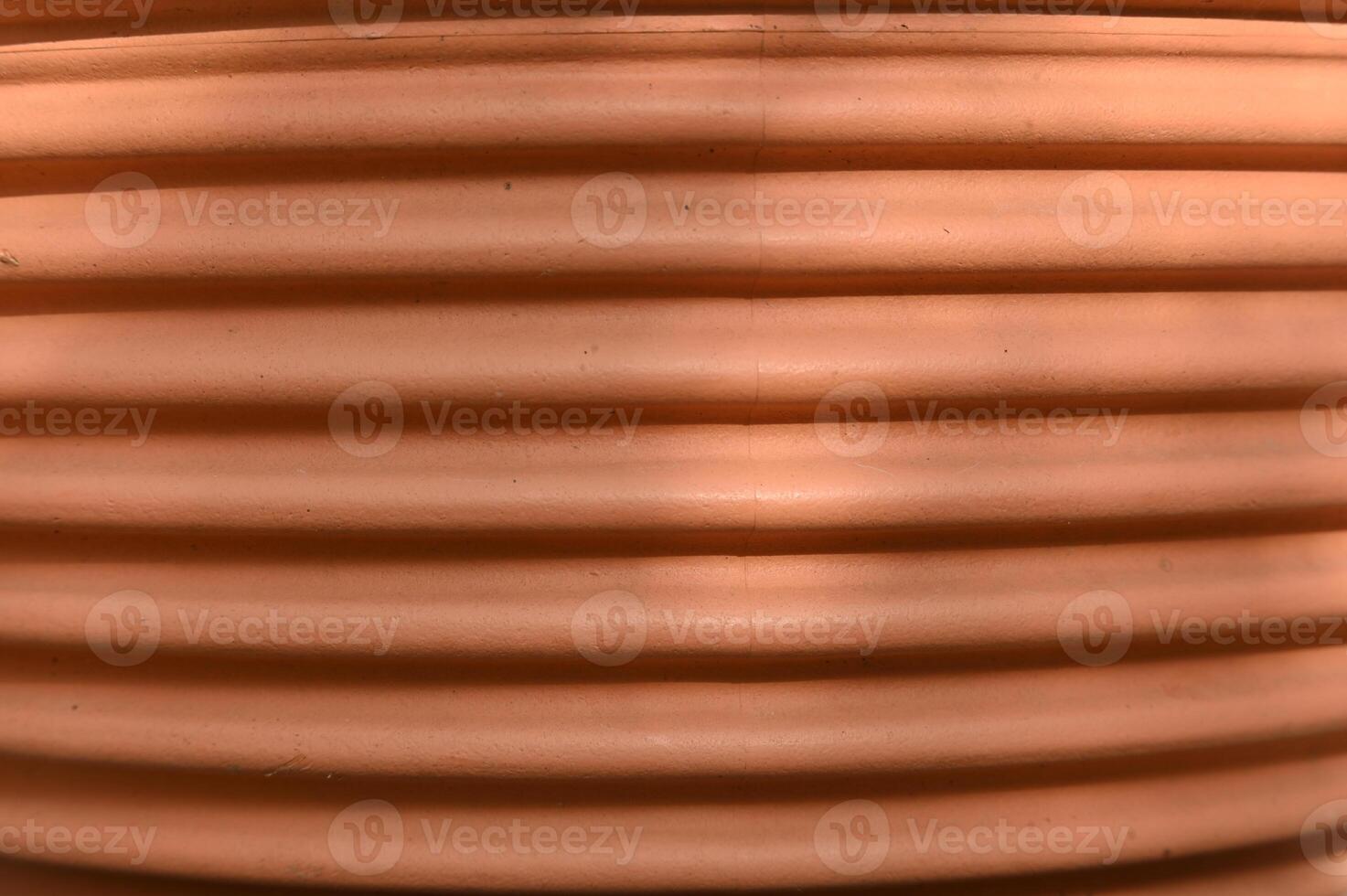 a close up of a large pot with a bird sitting on it photo