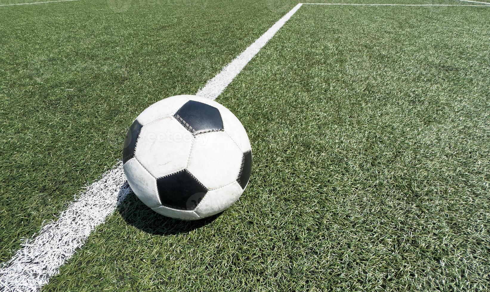 Black and white soccer and football ball in the field. Horizontal sport theme poster, greeting cards, headers, website and app photo