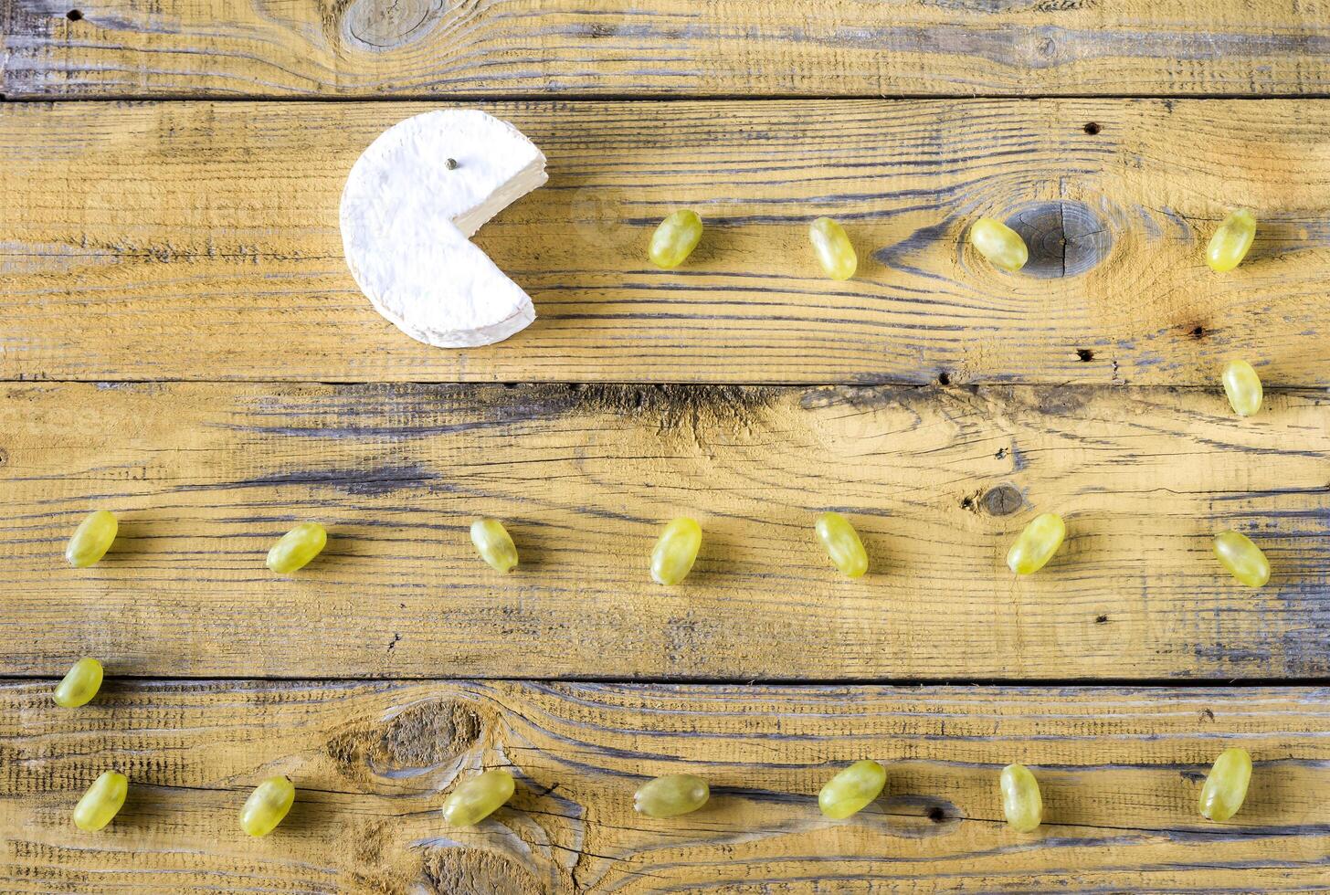 Camembert with green grapes photo