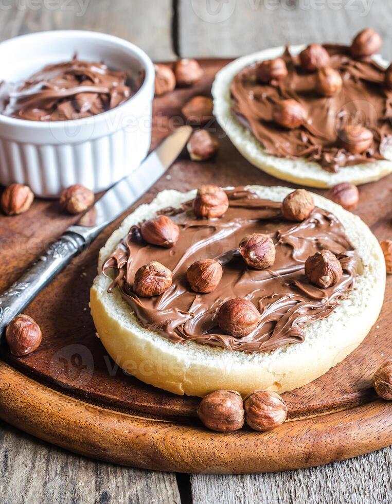 Bun slices with chocolate cream and nuts photo