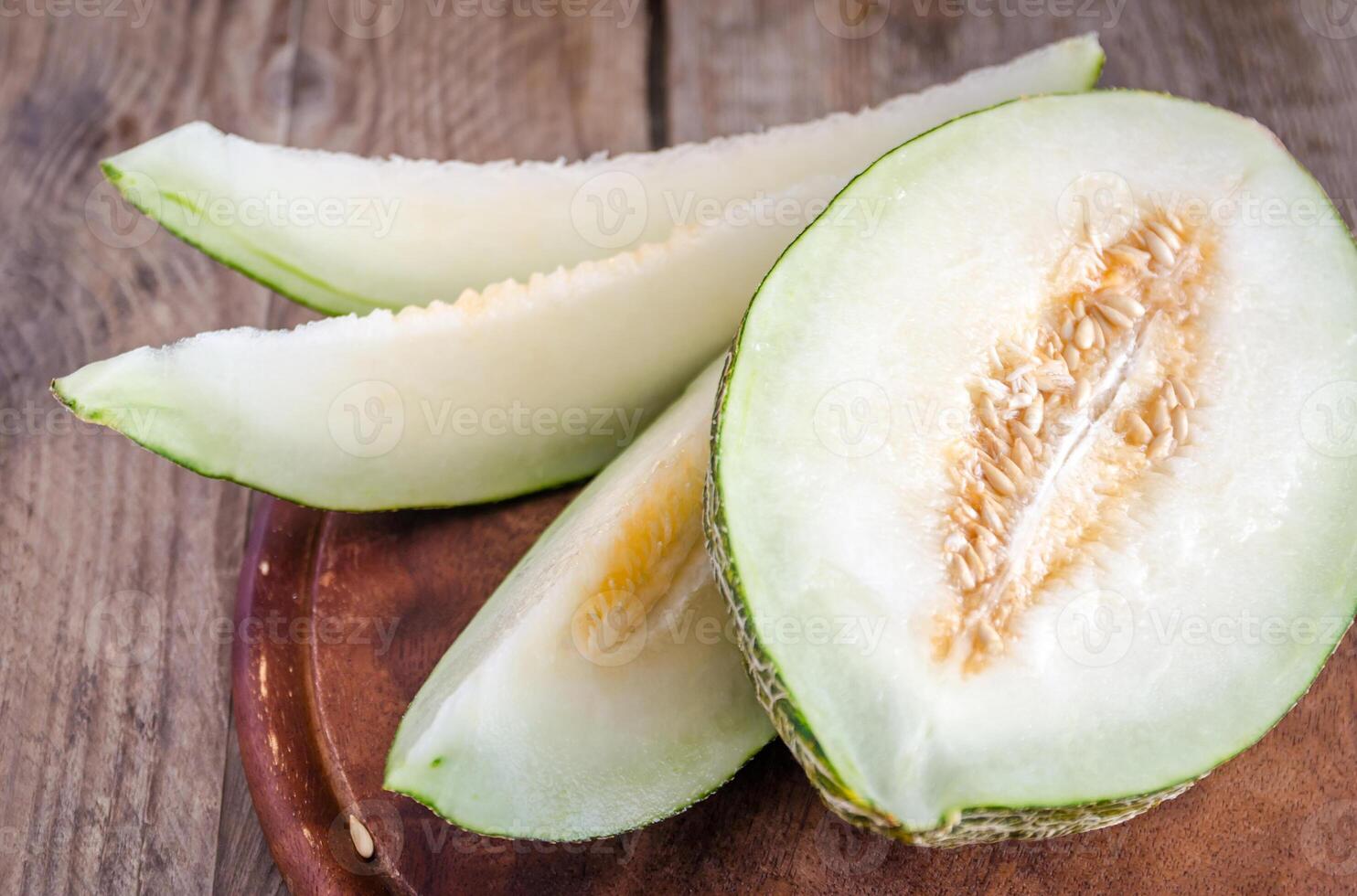 Piel De Sapo Melon On The Wooden Background photo