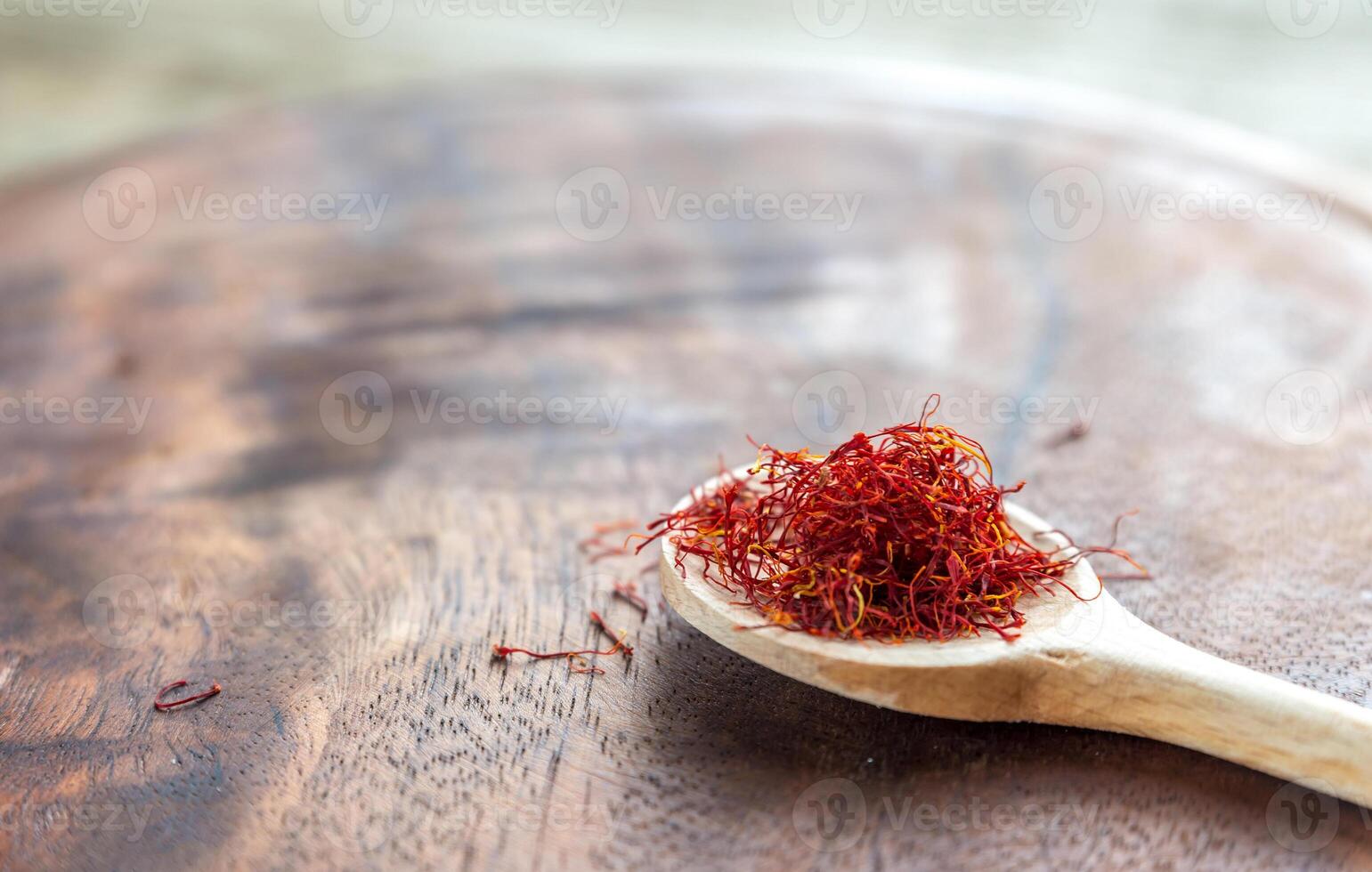 Saffron on the wooden spoon photo
