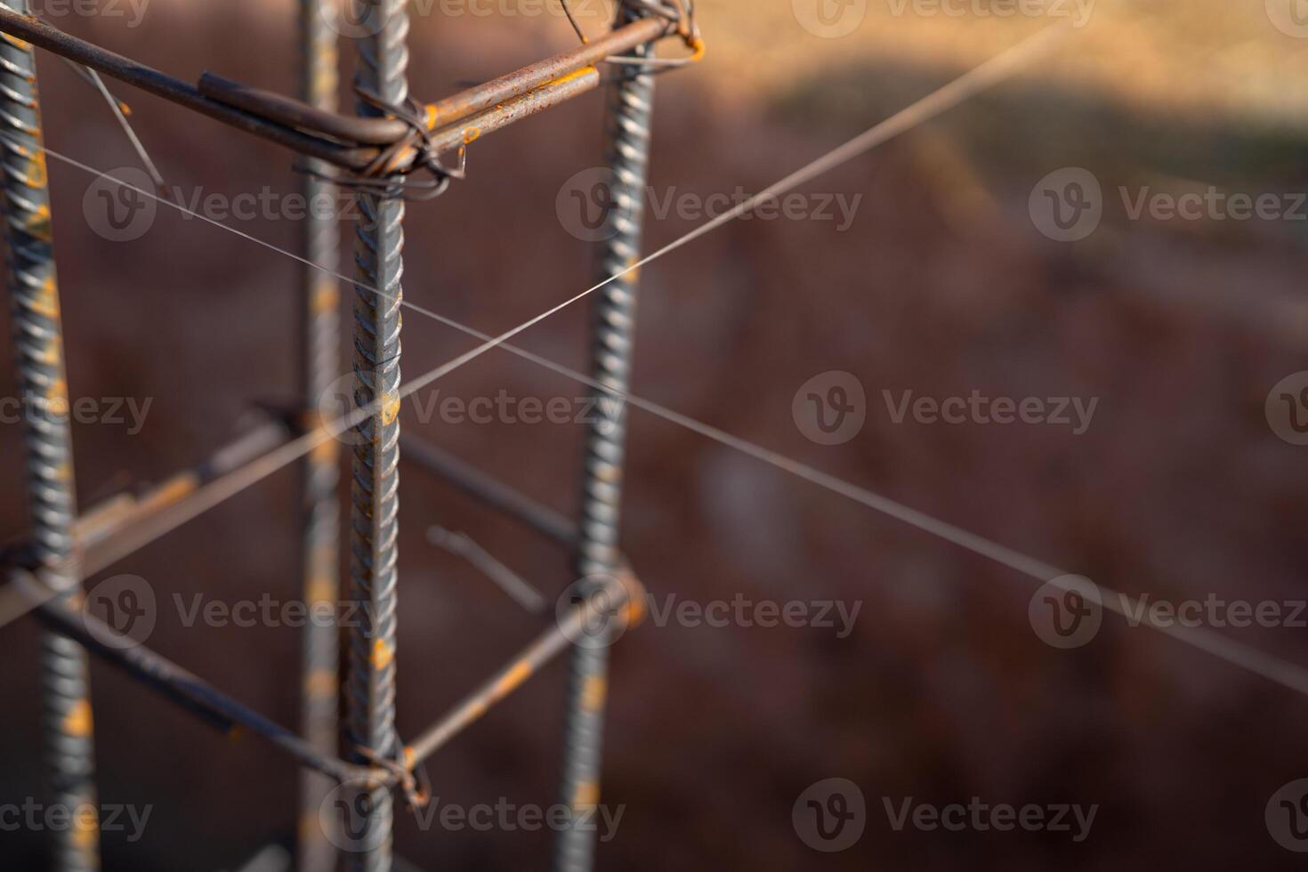 Rebars for concrete foundations at a construction site. Steel bars and iron structure ready for concrete casting. Essential materials and techniques for reinforced concrete in new building projects. photo
