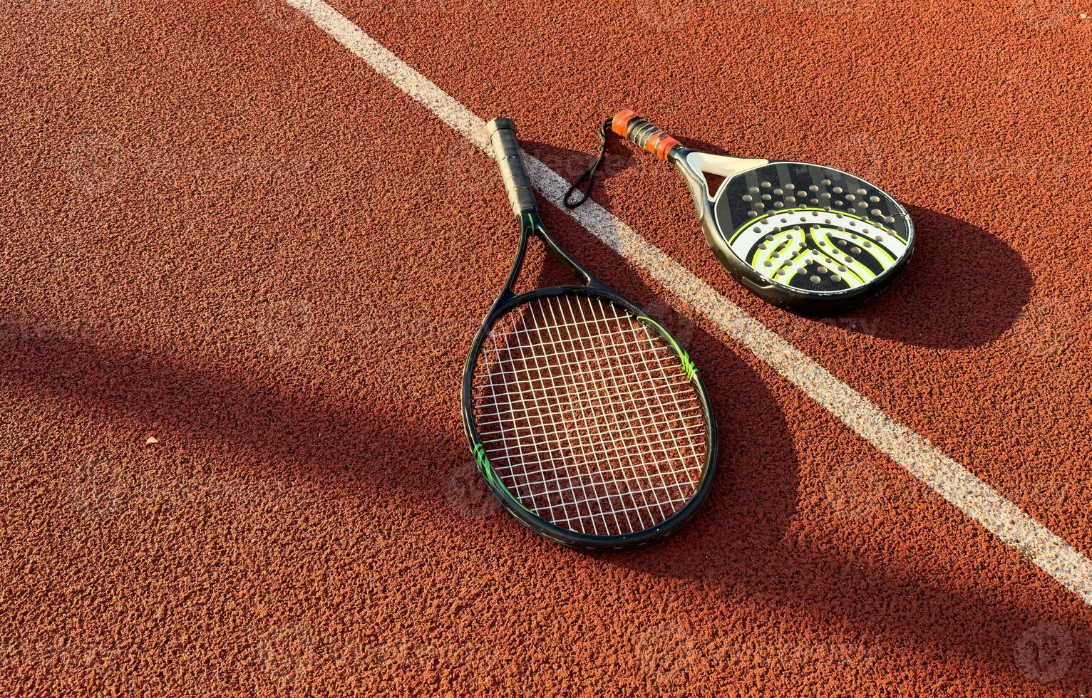 racket in the tennis court photo