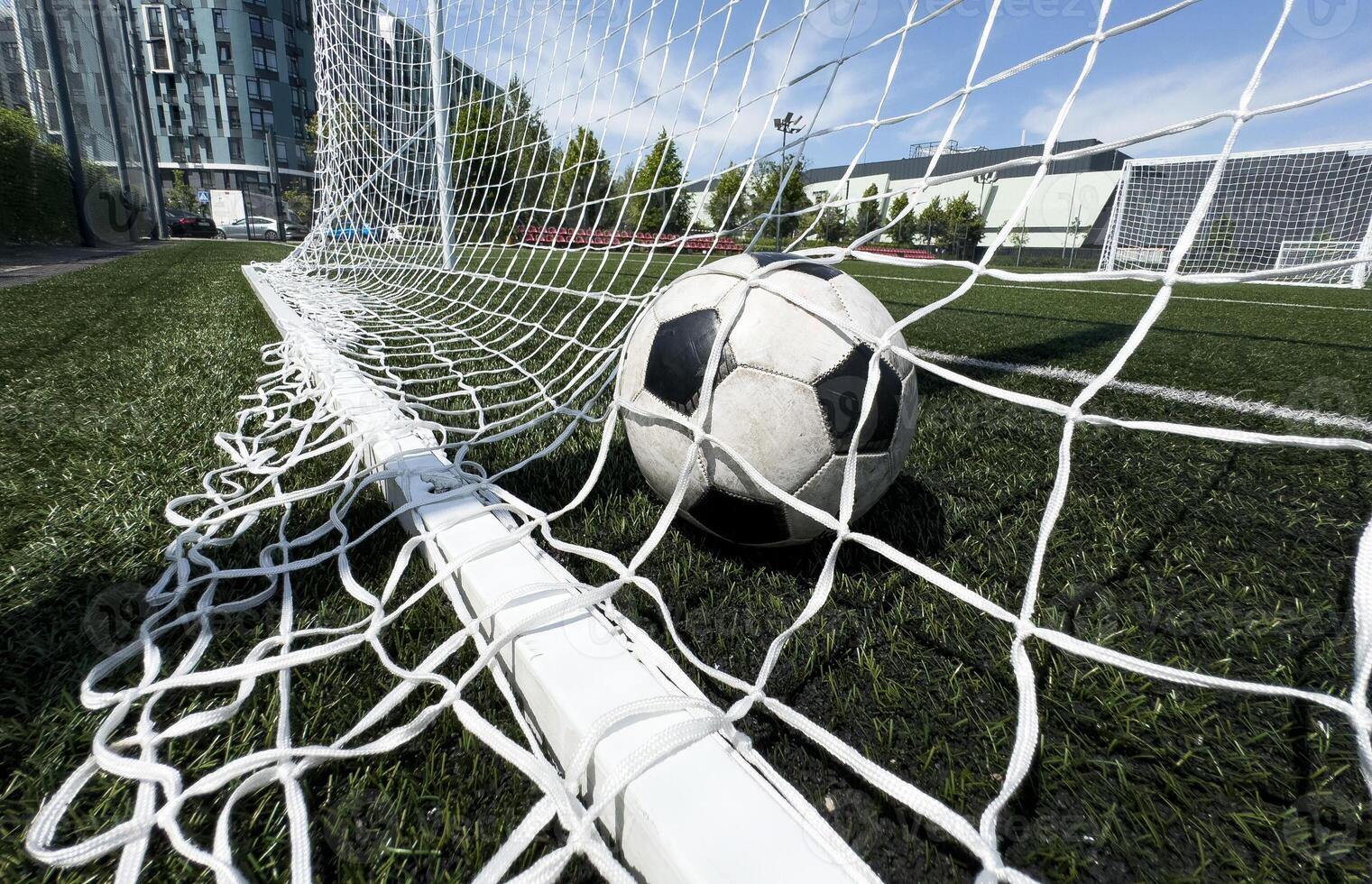 Goal in the back of net in soccer game photo