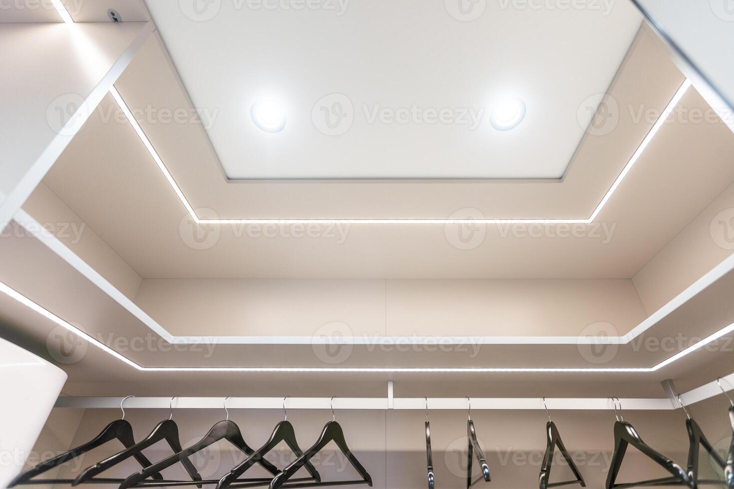 Fragment of a stretch ceiling with the hidden LED illumination photo