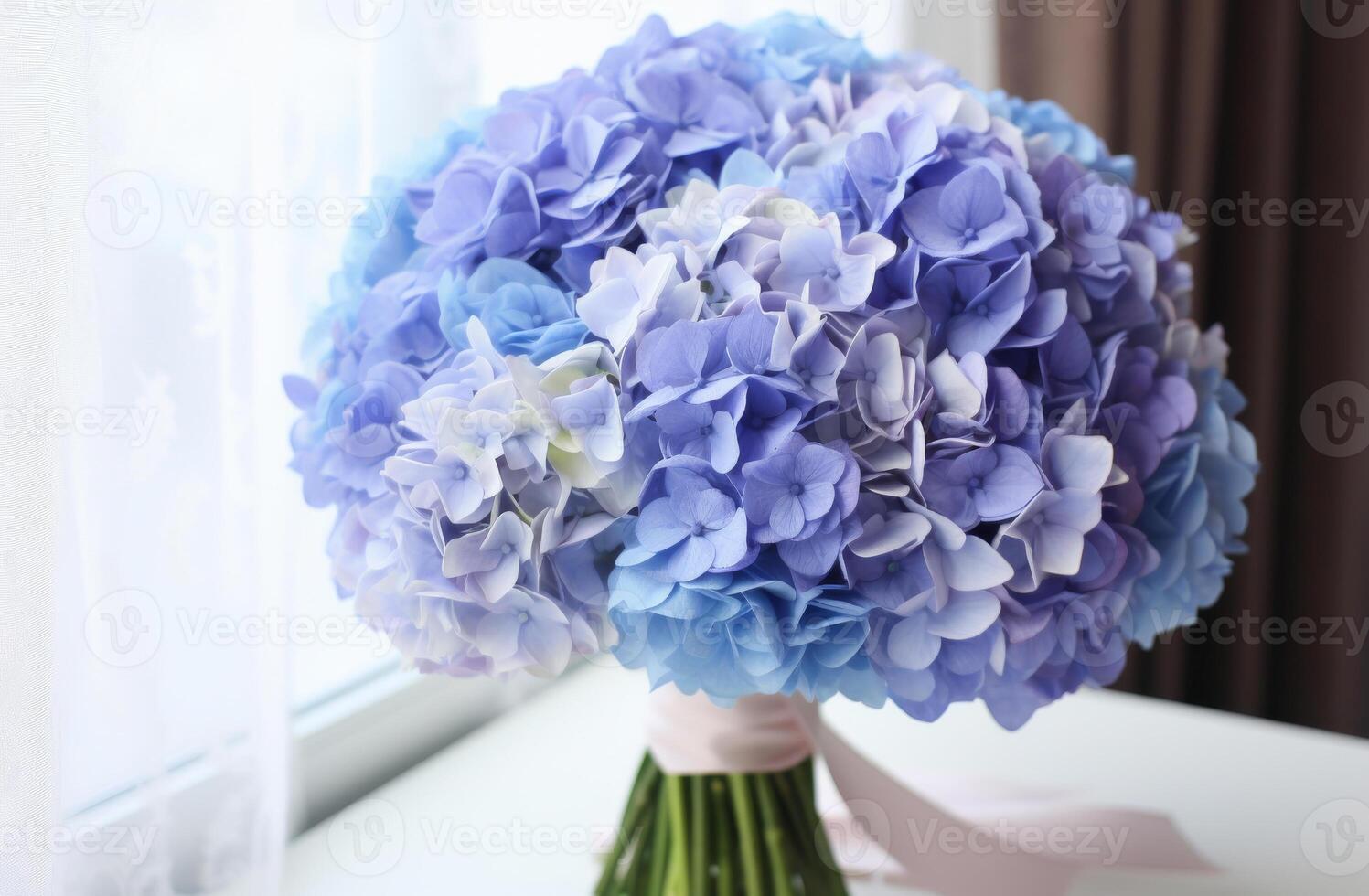 A bouquet of blue hydrangea on a table. photo