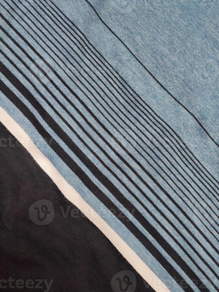 fabric texture with black, white and blue striped patterns photo
