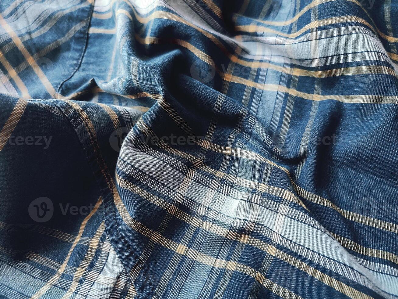 The texture of the shirt fabric has a checkered pattern photo