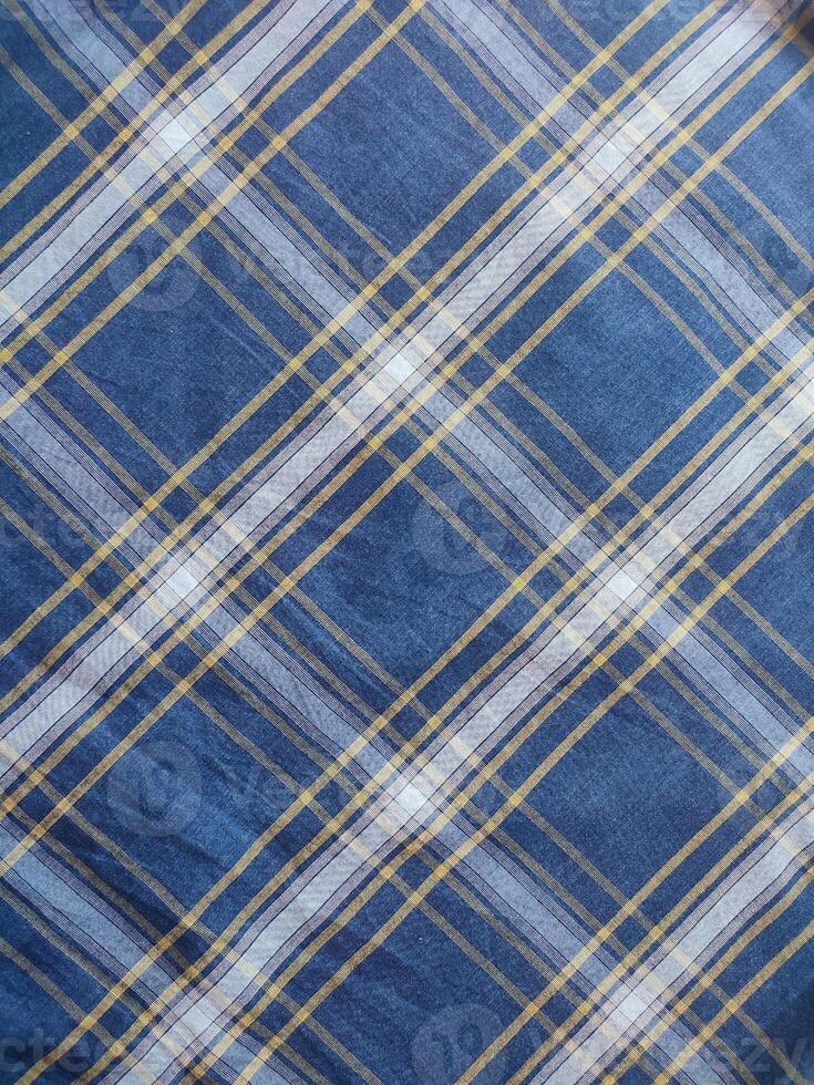 The texture of the shirt fabric has a checkered pattern photo